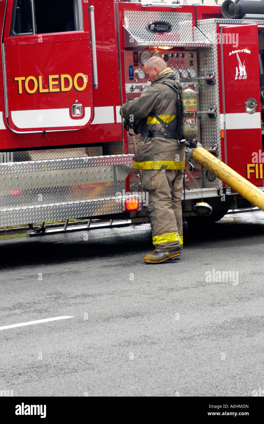 Firefighter wearing breathing aparatus at a fire in downtown Toledo