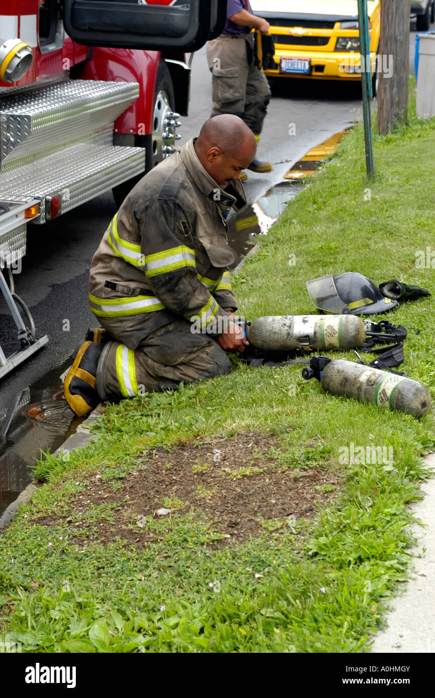 Firefighter on the job in downtown Toledo Ohio preparing his breathing