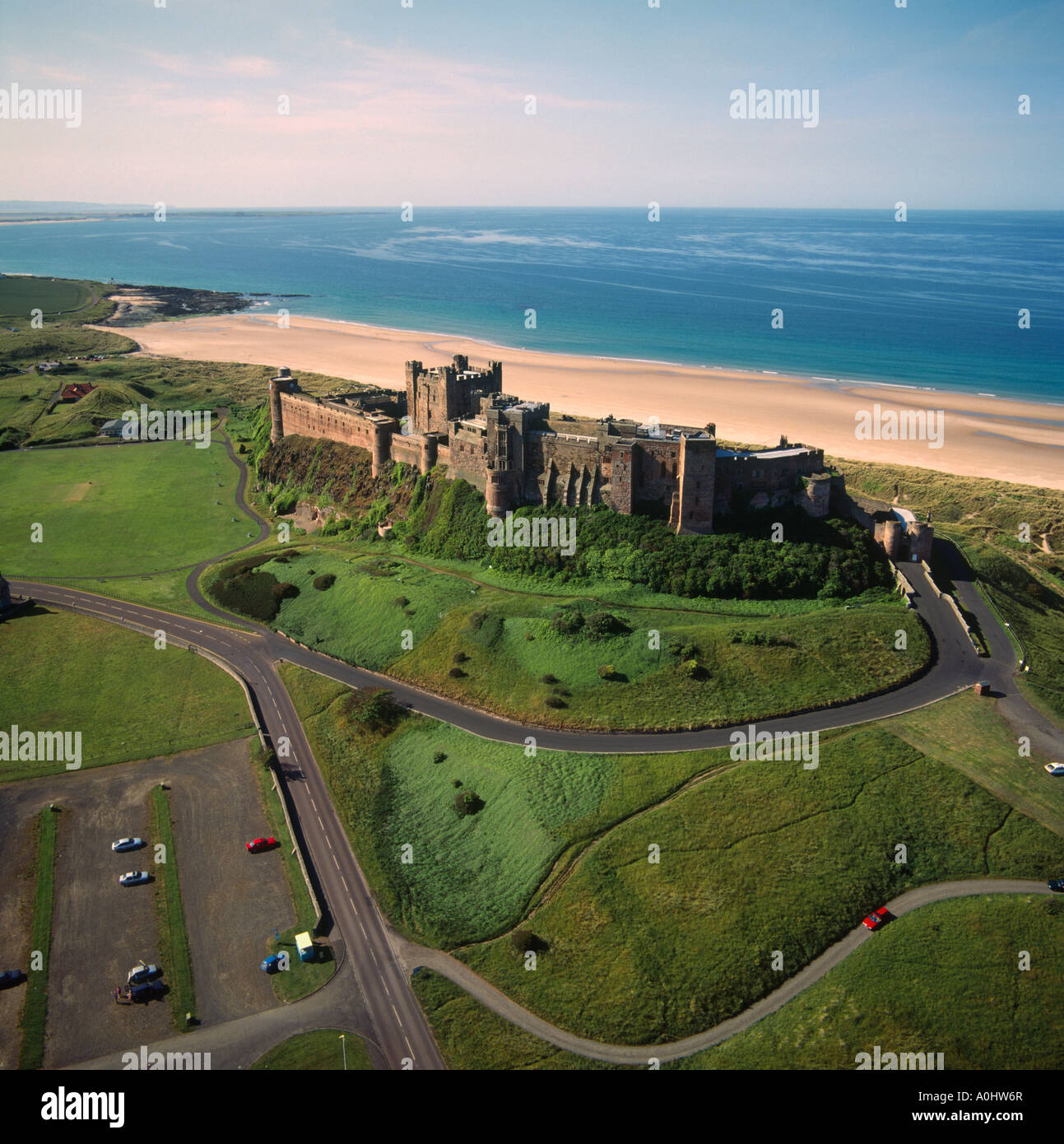 Aerial view of Bamburgh Castle towards Lindisfarne UK Stock Photo