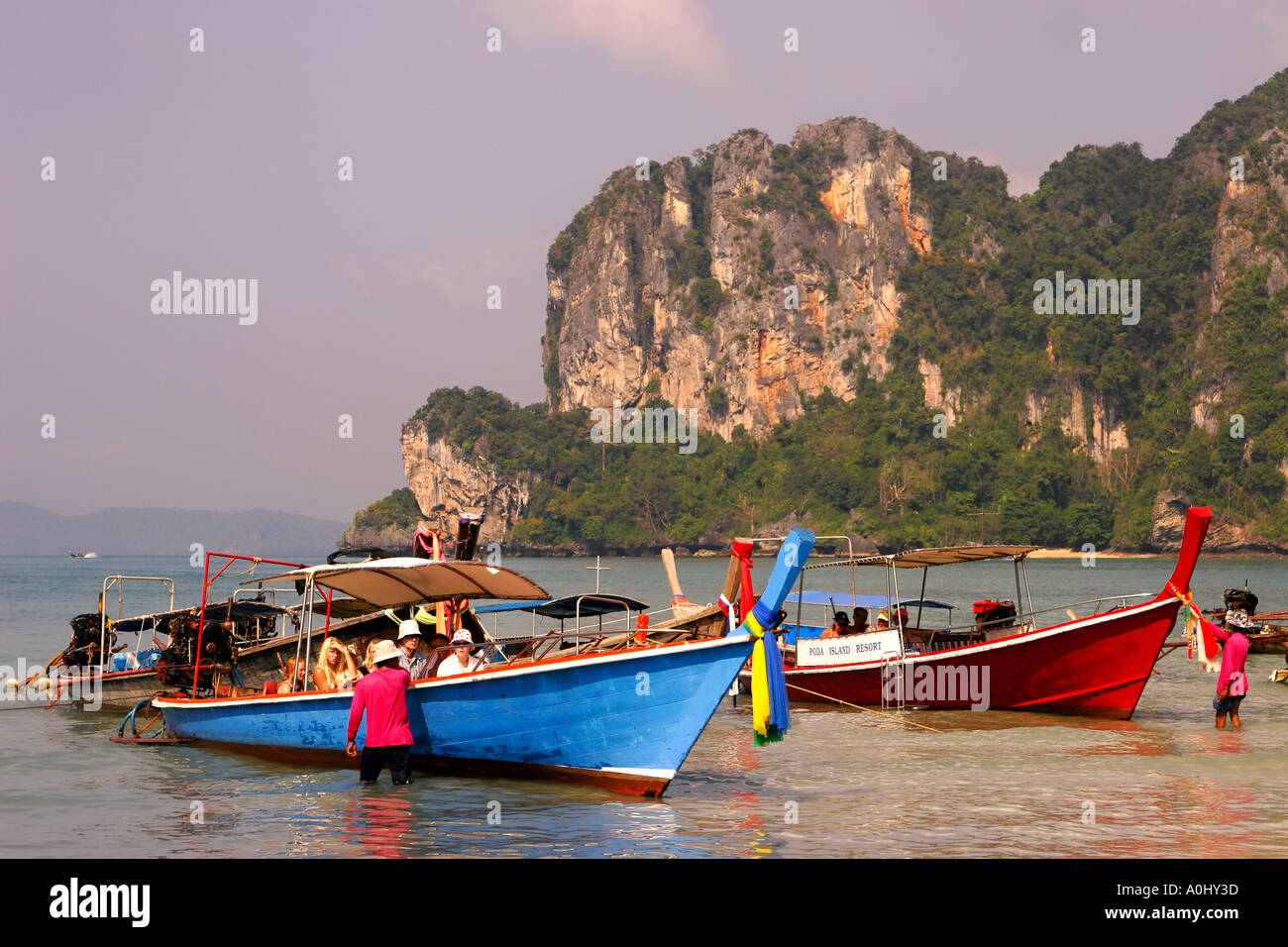 THA Thailand Krabi Railay beach long tail boats tourists Stock Photo