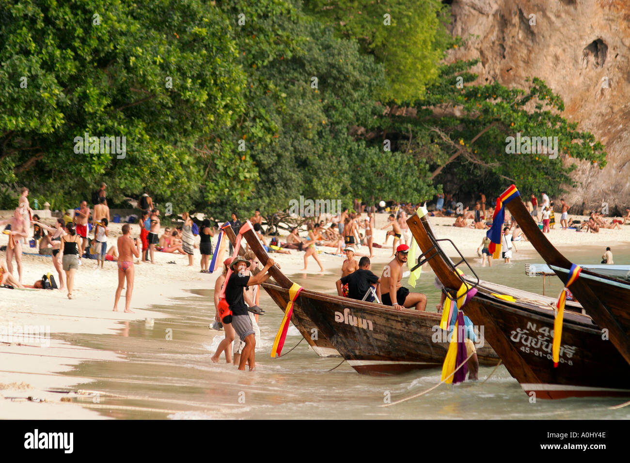 Thailand Phra Nang Krabi Hat Tham Phra Nang beach cliff long tail boats Stock Photo