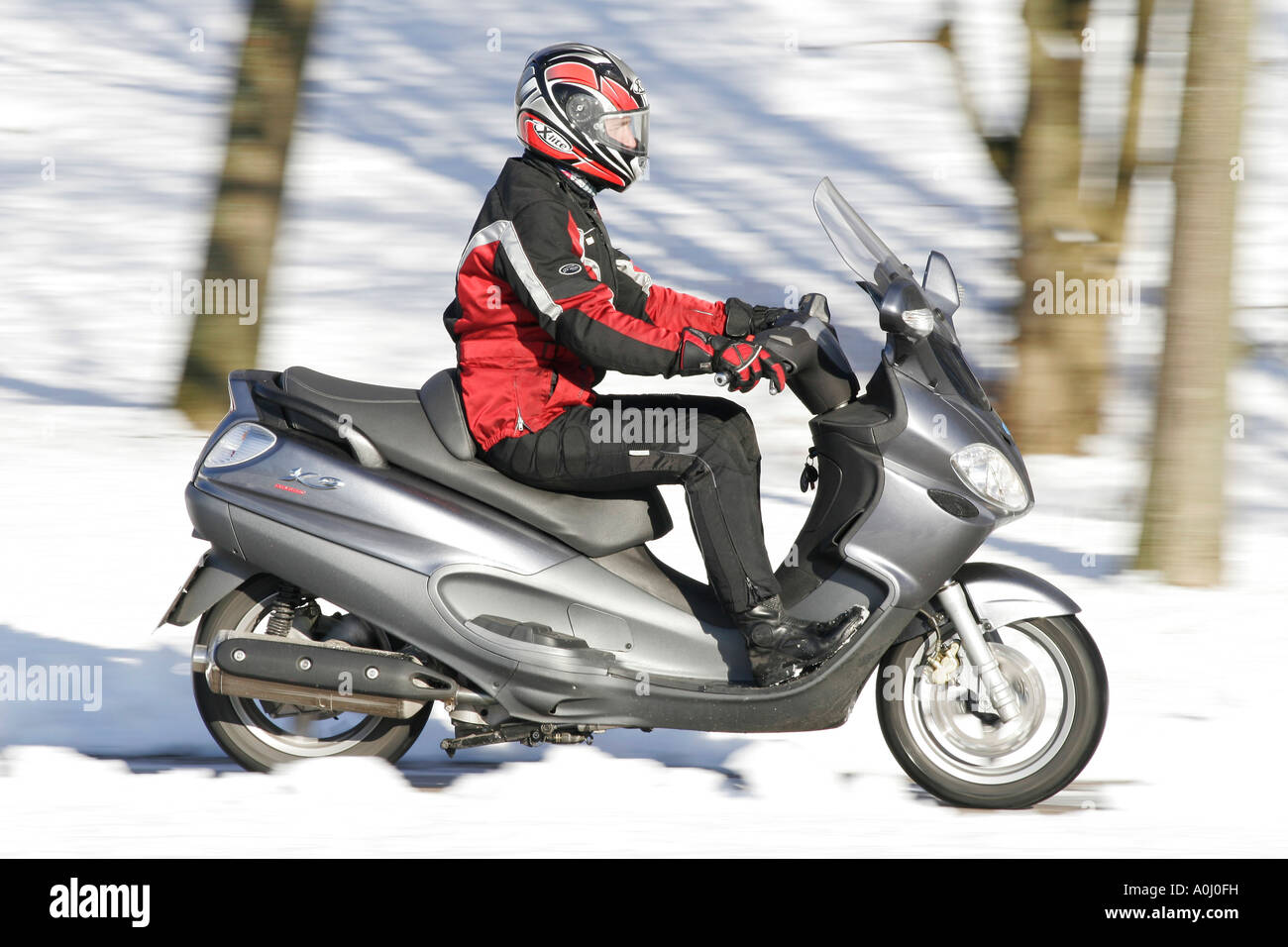 Motorscooter in winter Stock Photo Alamy