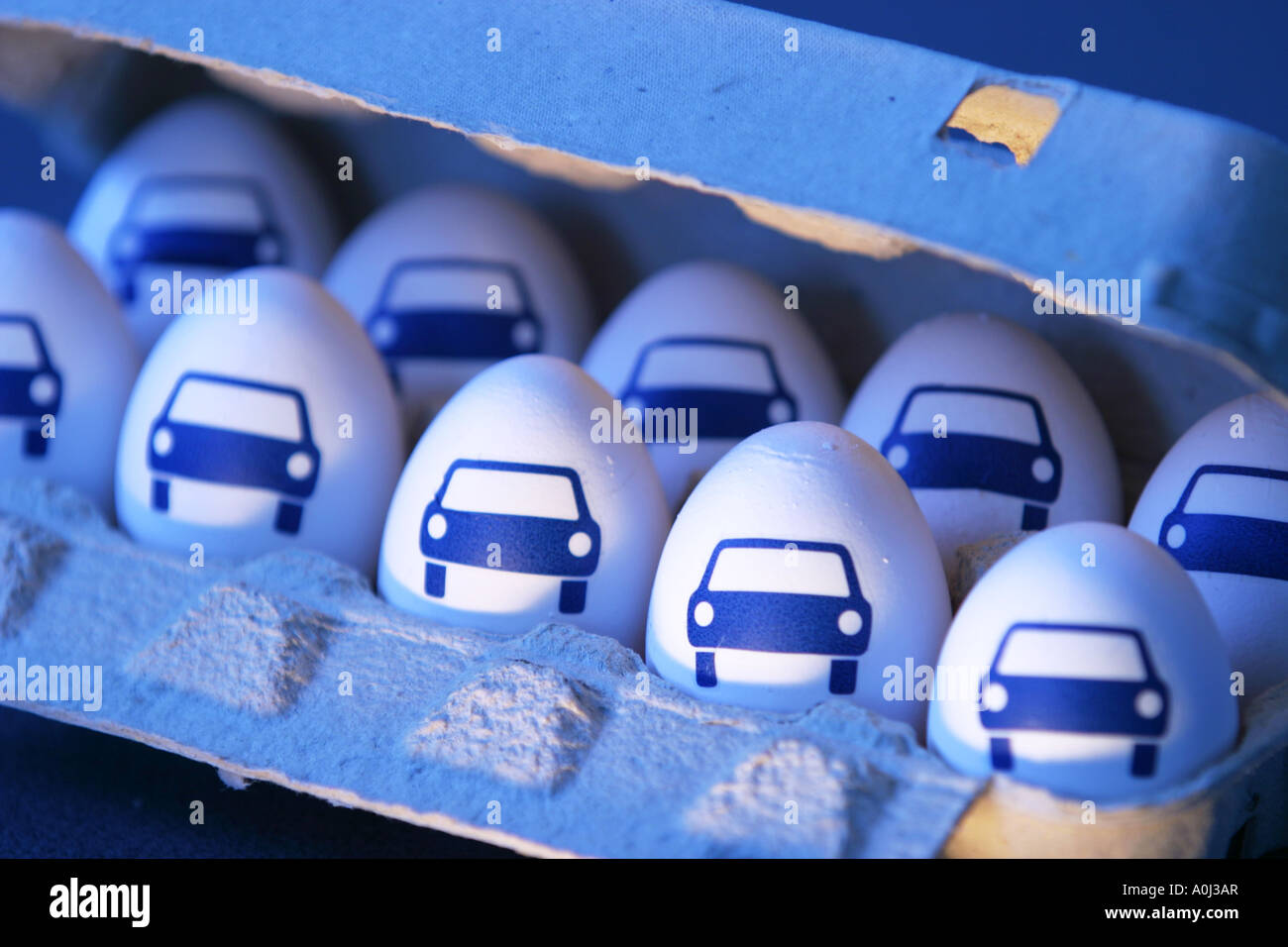 Eggs with pictures of car in an egg carton Stock Photo