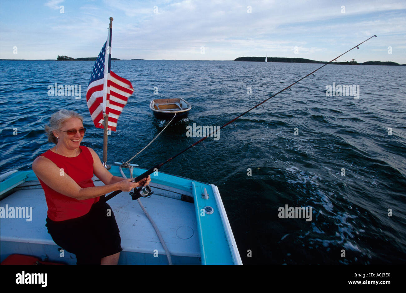 Maine,ME,New England,Down East,Freeport,Harraseeket River water woman,female,women,fishing,sport,athlete,recreation,water,from 30 foot launch ME014,vi Stock Photo