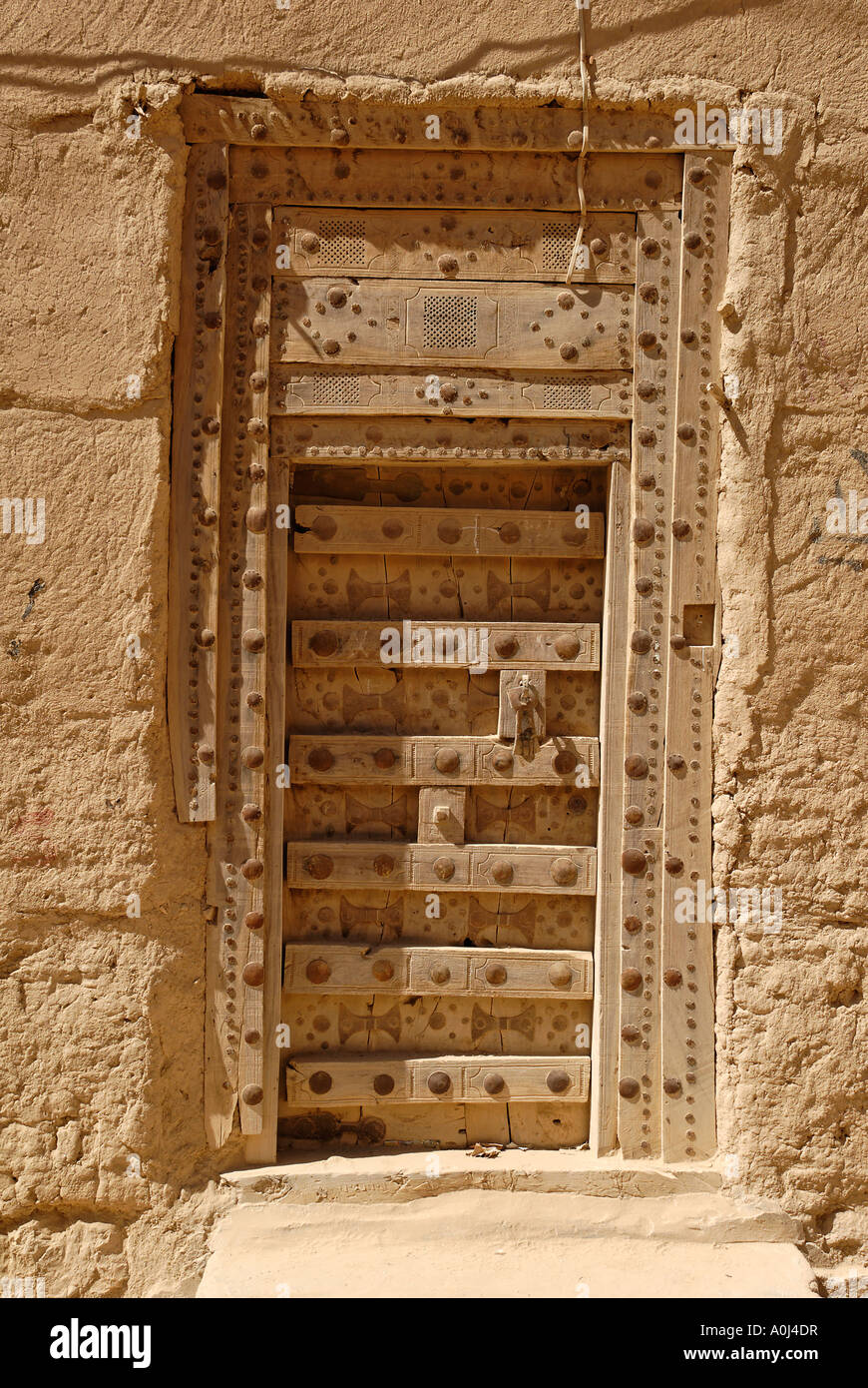 Historic door in the old town of Al Hajjaryn, Wadi Doan, Hadramaut, Yemen Stock Photo
