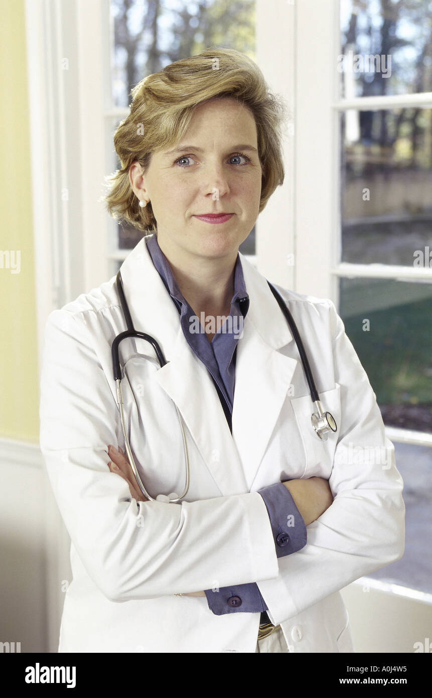 Close up of a female doctor with stethoscope around neck hires stock