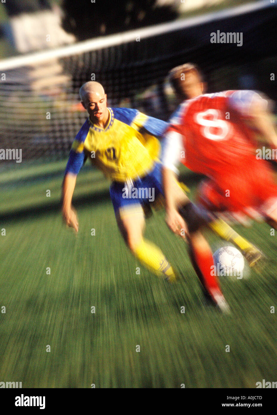 Two young men playing soccer Stock Photo
