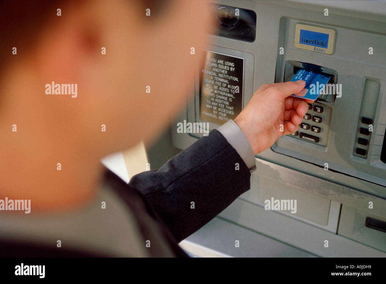 Person making an ATM transaction Stock Photo