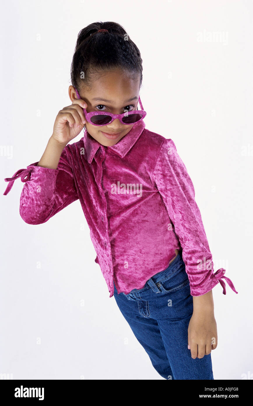 Portrait of a girl standing wearing sunglasses Stock Photo - Alamy