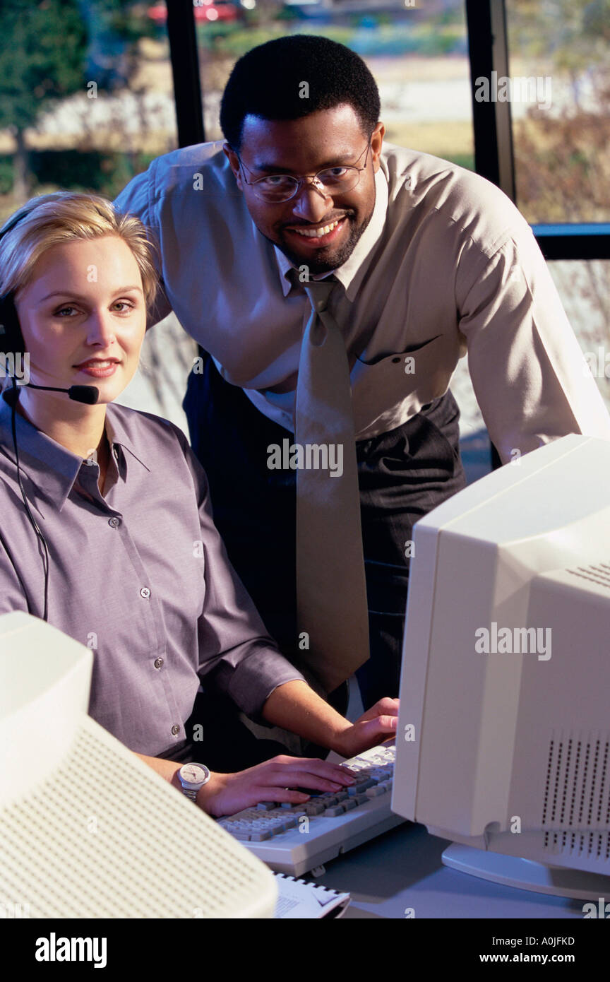 Portrait of two customer service representatives smiling Stock Photo ...
