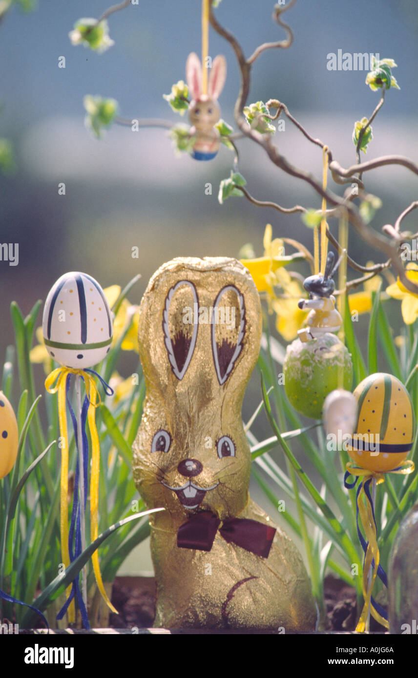 Painted Easter eggs oudoor in garden chocalte rabbit Stock Photo