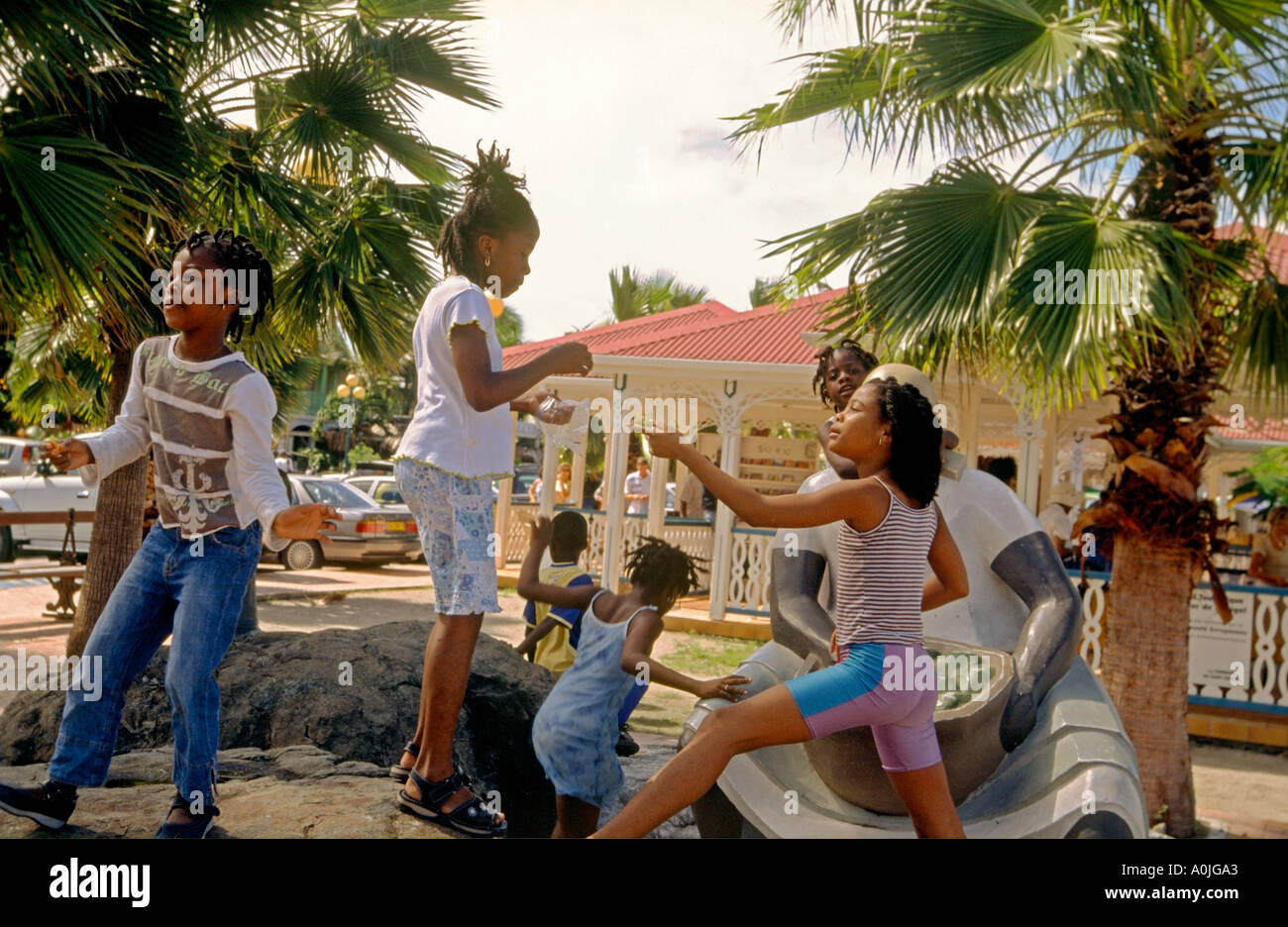 Marigot Saint Martin French West Indies kids near market place playing Stock Photo