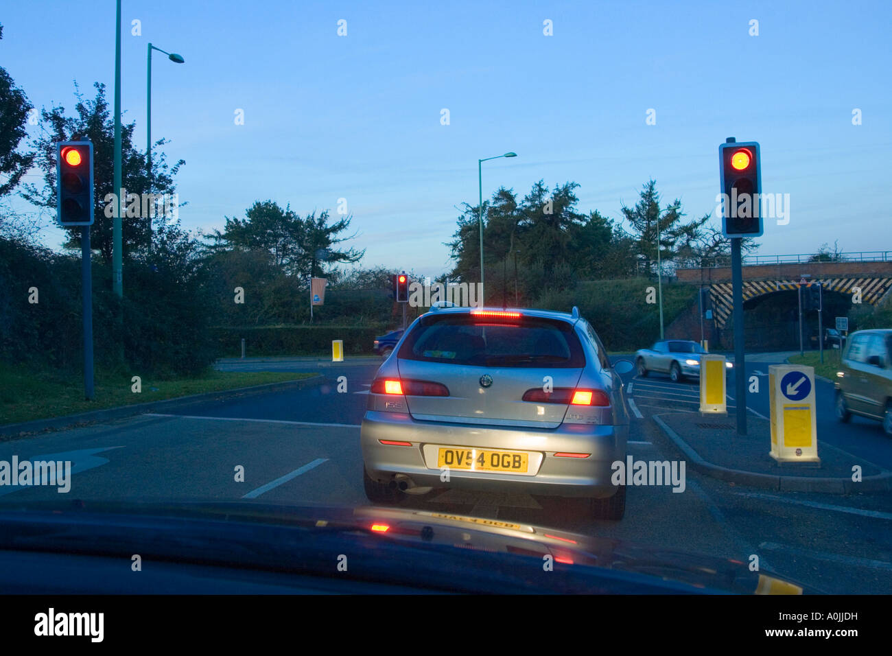stopped at traffic lights on red in UK England Stock Photo - Alamy