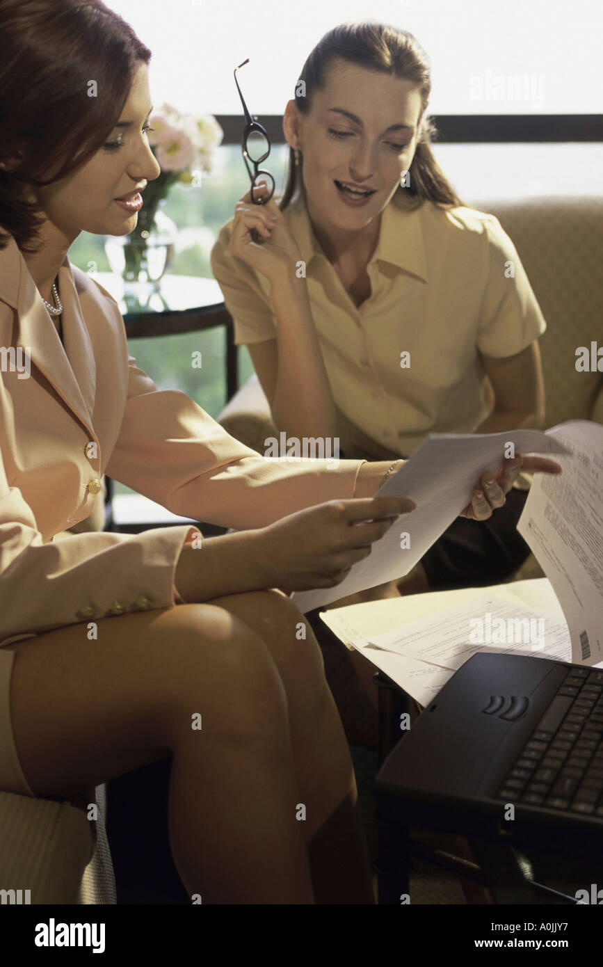 Two businesswomen discussing in an office Stock Photo - Alamy