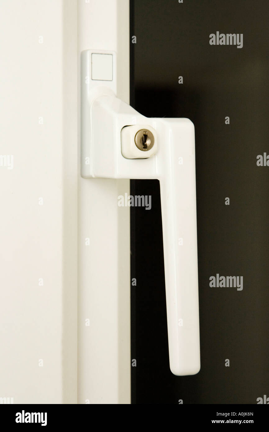 lockable security  handle fitted on double glazed window Stock Photo