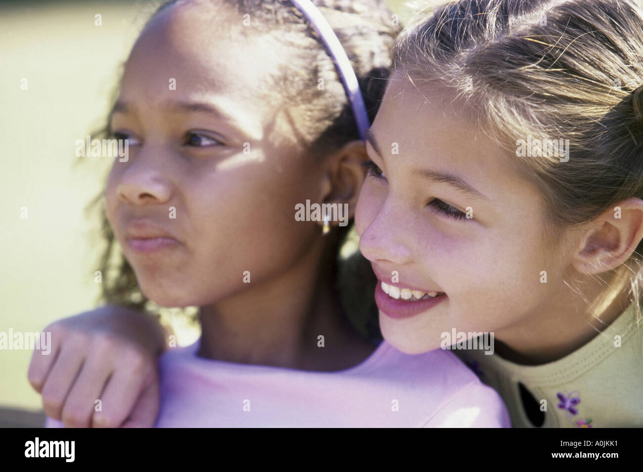 Close-up of two girls smiling Stock Photo - Alamy