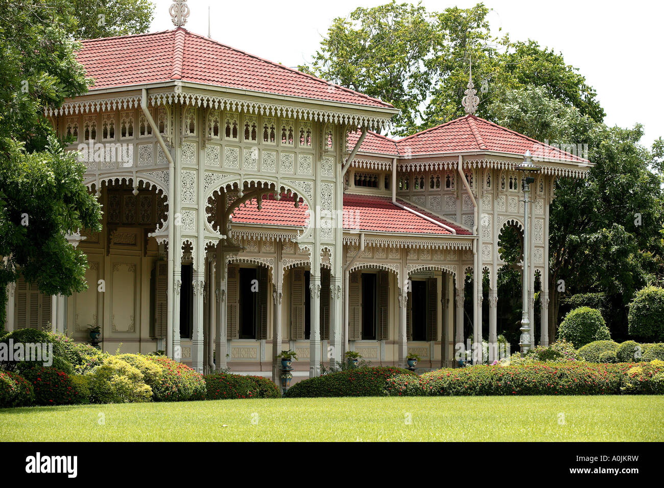 Exterior view of the Abhisek Dusit Throne Hall in Dusit Park Bangkok Thailand The facade features a veranda carved in timber latticework The building now houses the Support Museum which displays traditional crafts Stock Photo