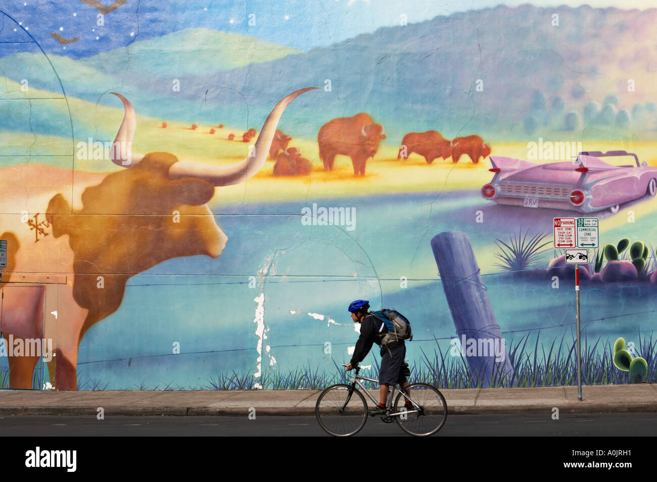 TEXAS Austin Mural with Cadillac and Texas longhorn steer on side of building Sixth Street entertainment district Stock Photo