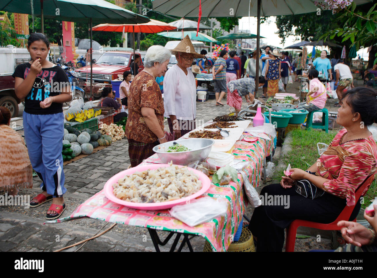 Ladies shop at a food stall in Chiang Mai North East Thailand Stock ...