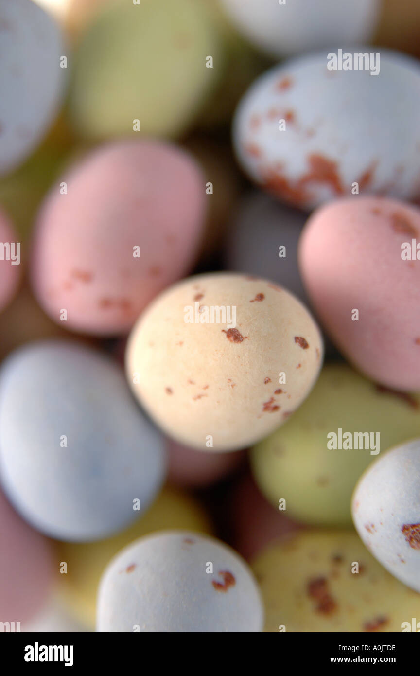 Small, sugared, dappled, mini, Easter eggs. In realistic, soft, subtle, pastel colours; white, cream, pink, blue and green. Narrow depth of field. Stock Photo