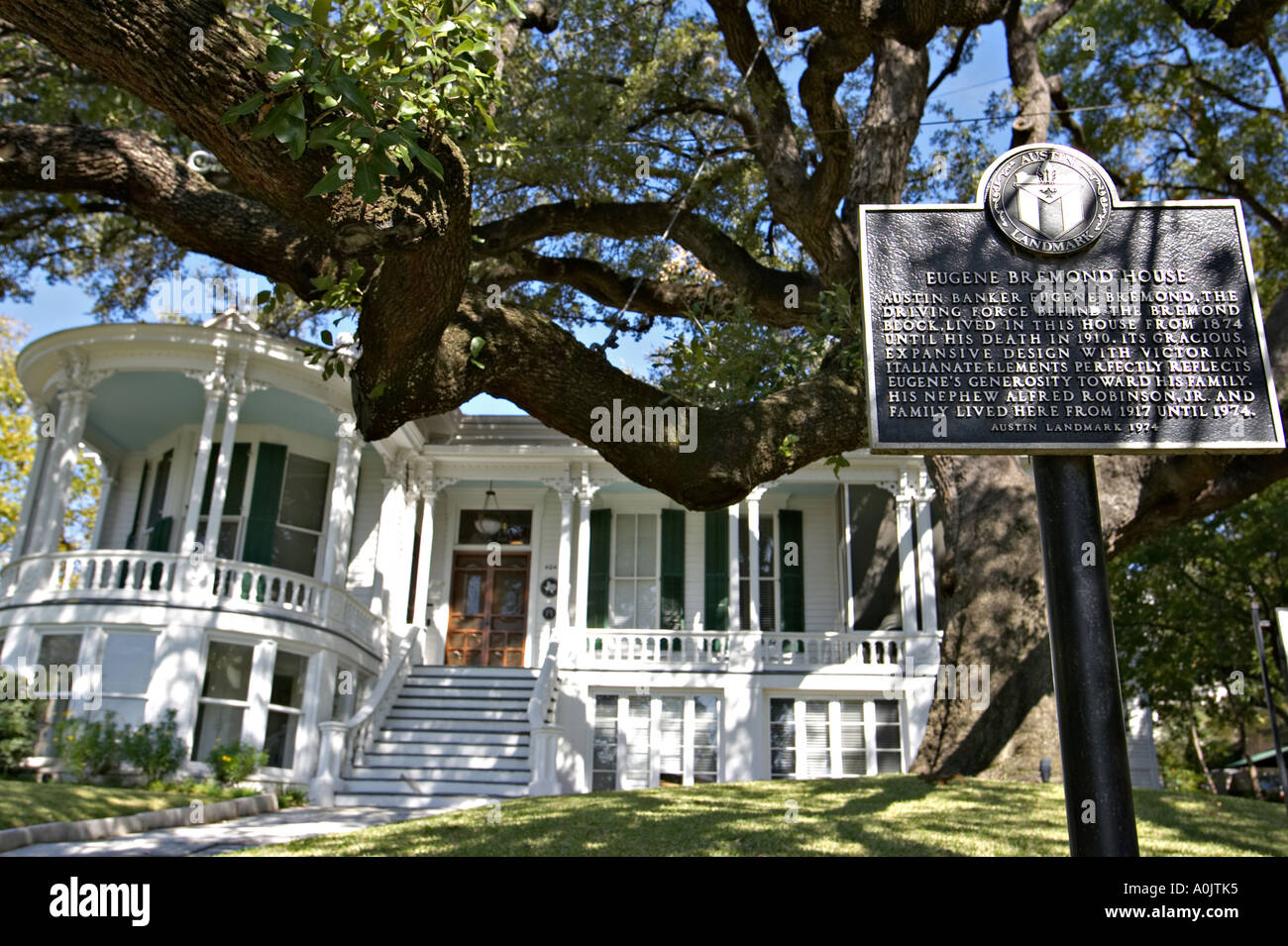 TEXAS Austin Historic marker in front yard of Eugene Bremond House large live oak tree elegant 19th century home Stock Photo