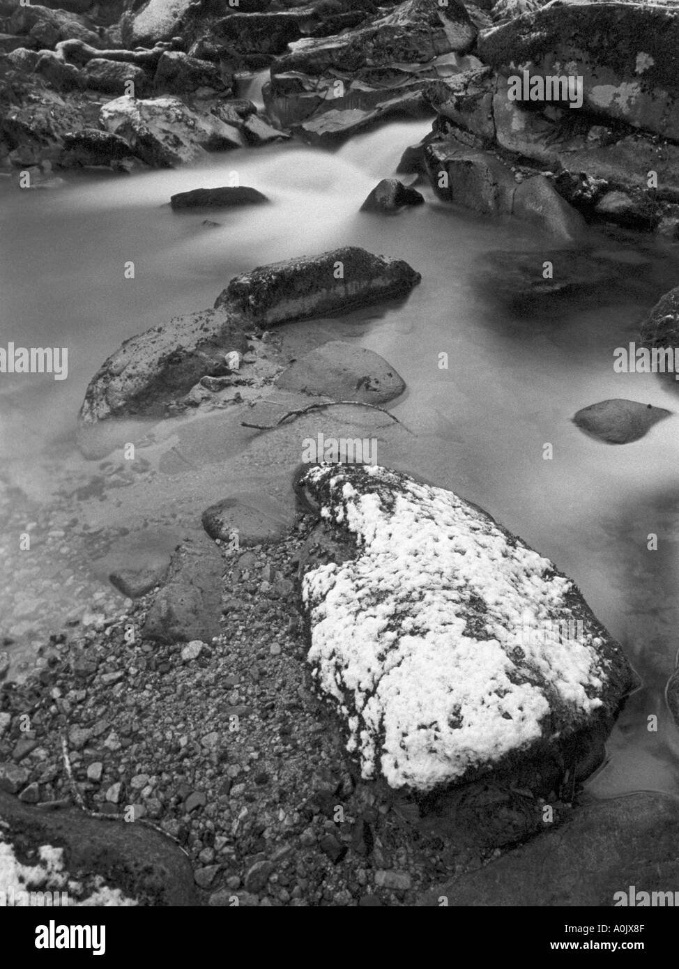 River Plym in the snow at Cadover Bridge Dartmoor in black and white Stock Photo