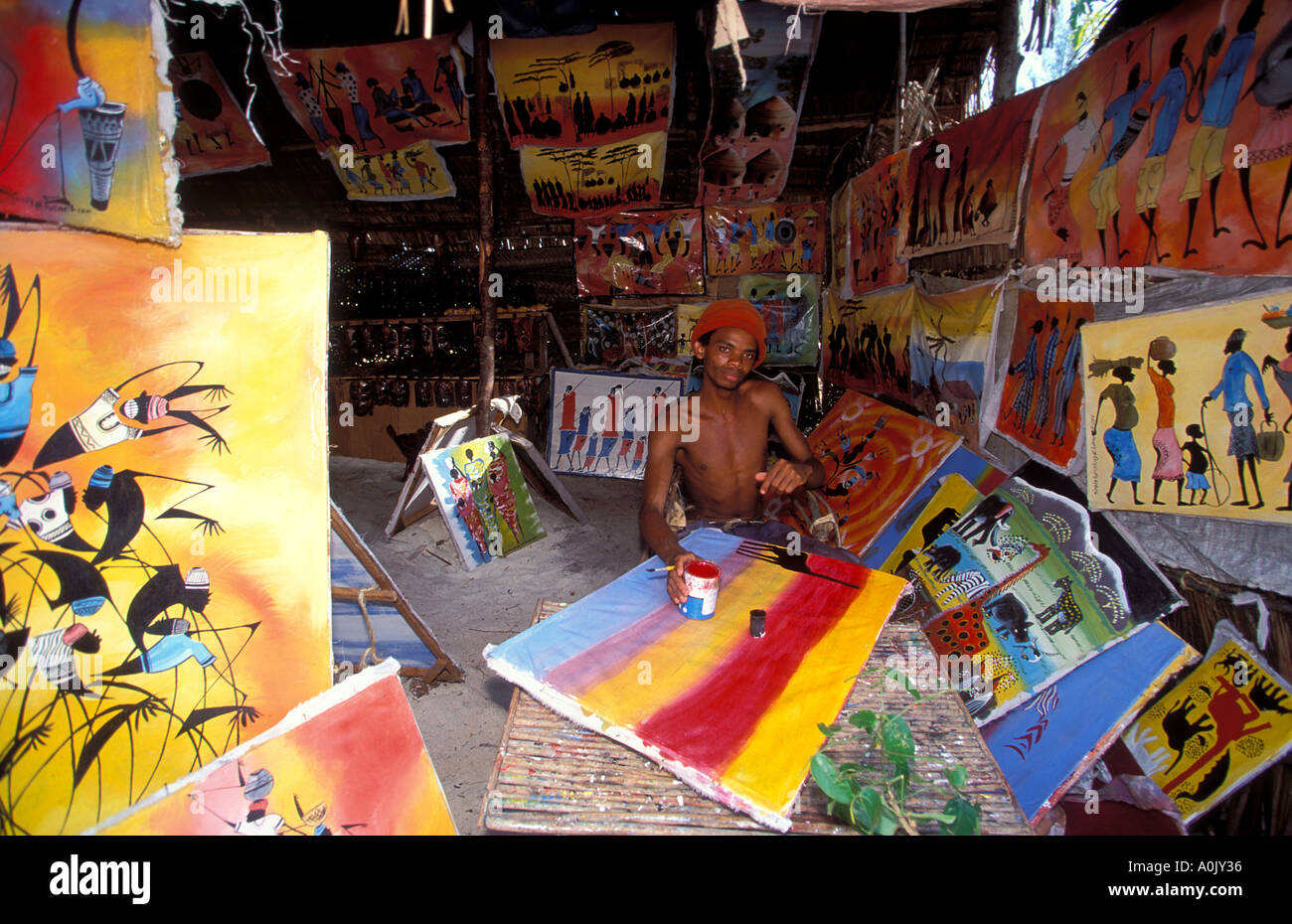 Local artist with his Tingatinga paintings Zanzibar Tanzania Stock Photo