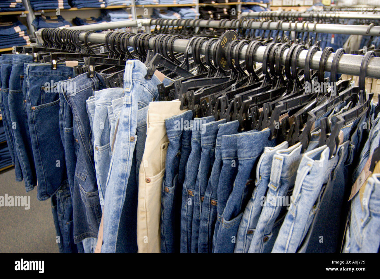Denim jeans on rack in store Stock Photo