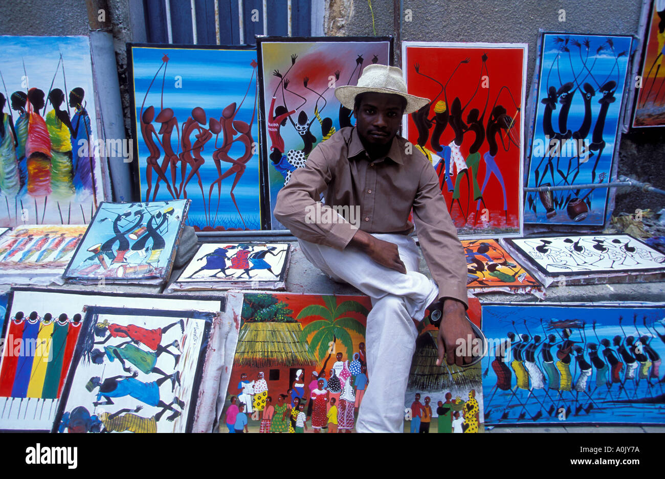 Local artist with his Tingatinga paintings Zanzibar Tanzania Stock Photo