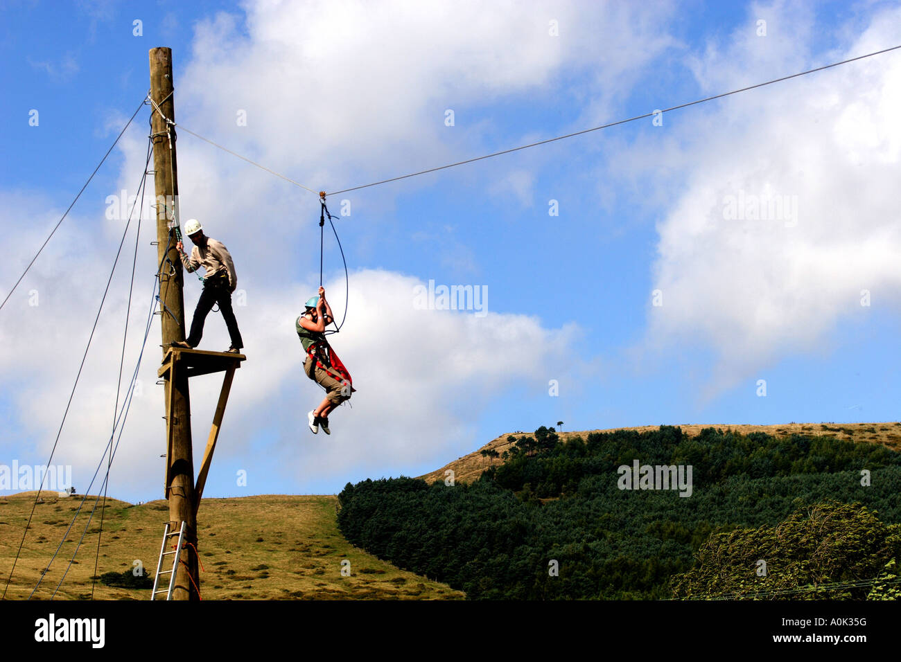 A young child on a zip wire in the Peak District National Park, Derbyshire , England, United Kingdom Europe European Stock Photo