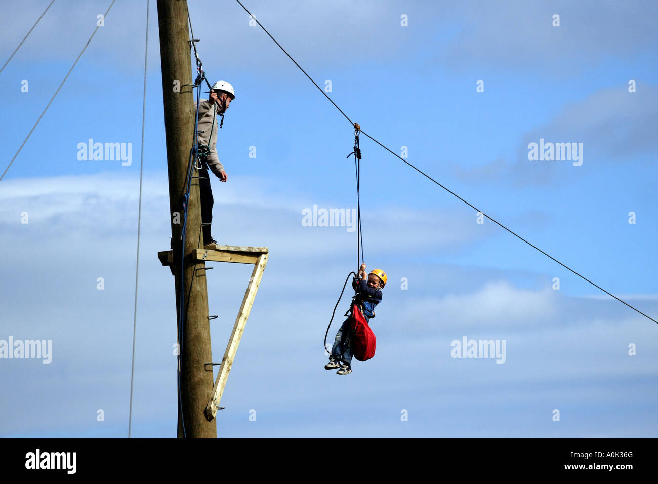 A young boy on a zip wire in the Peak District National Park, Derbyshire , England, United Kingdom Europe European Stock Photo