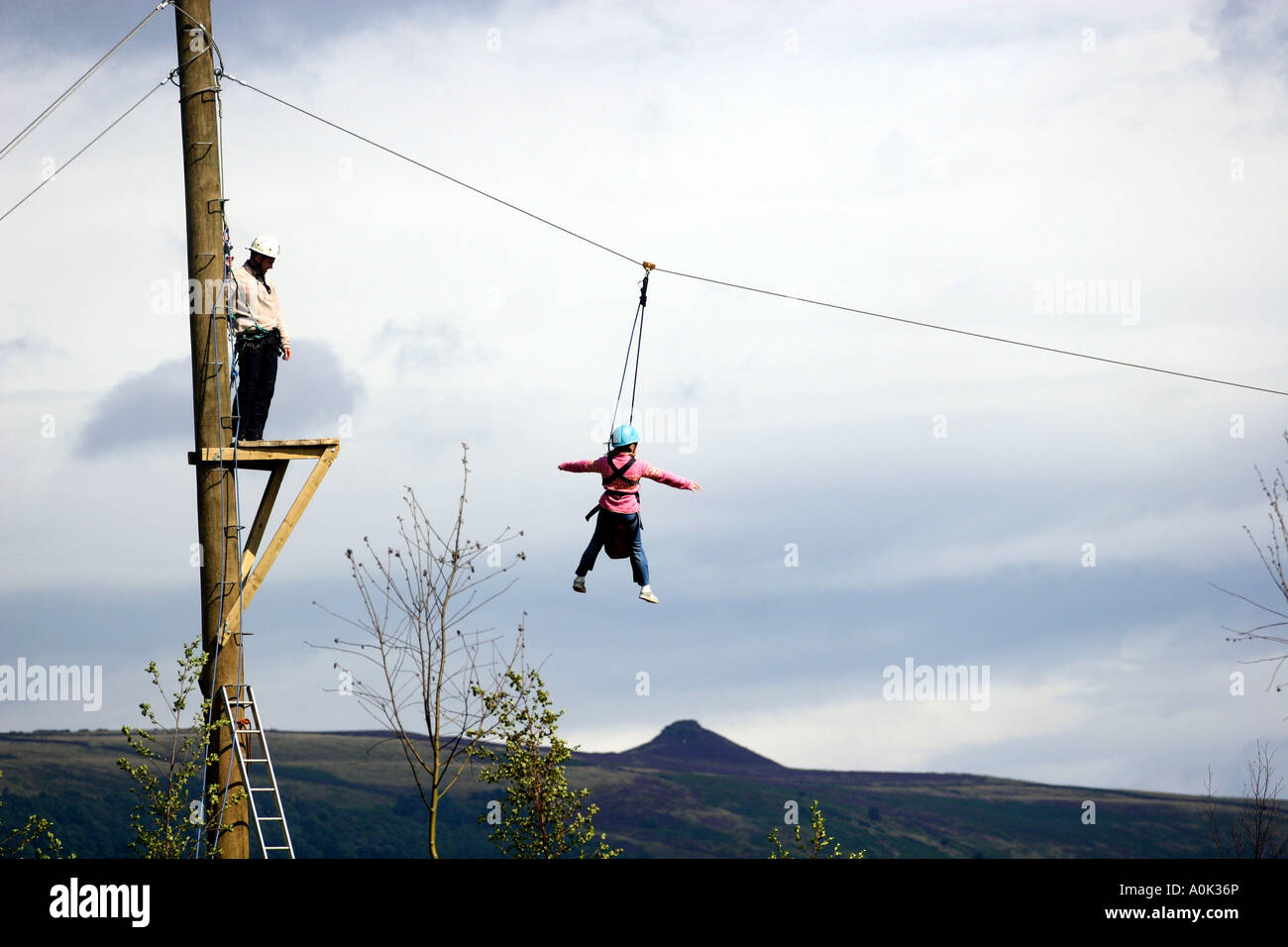 A young boy on a zip wire in the Peak District National Park, Derbyshire , England, United Kingdom Europe European Stock Photo