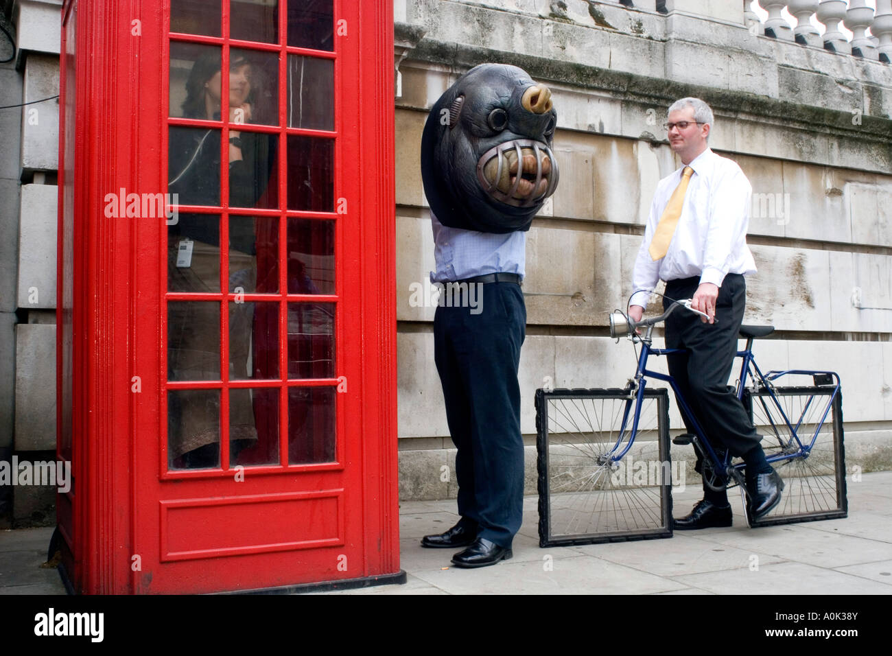 A queue for a red telephone box in London England Stock Photo Alamy