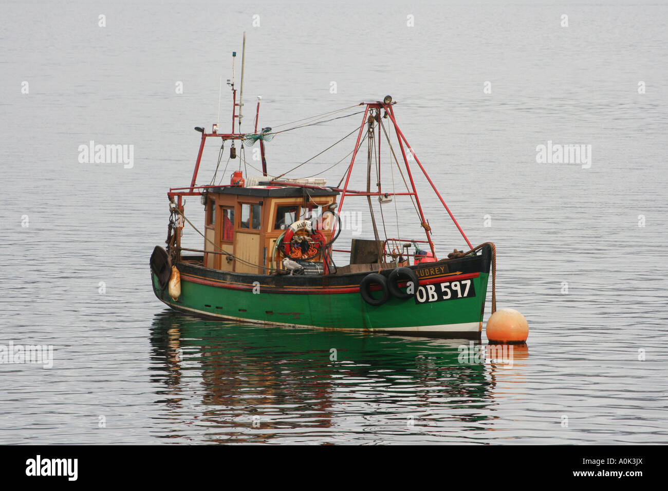Small fishing boat on Scottish loch Stock Photo - Alamy
