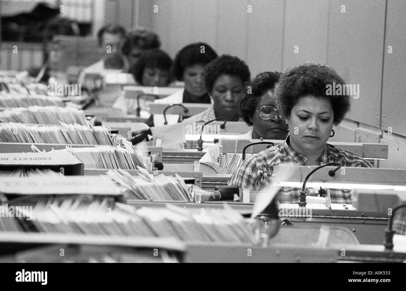 Postal clerks operate a letter sorting machine at the main post office in Detroit Michigan Stock Photo