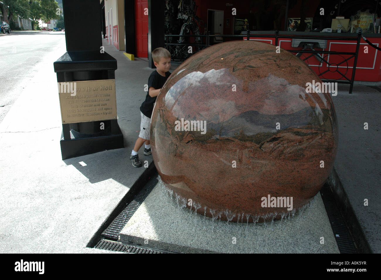 P31 246 10518 pound Granite Ball Floating On Water at Ripleys Believe It Or Not in Gatlinburg Ten Stock Photo