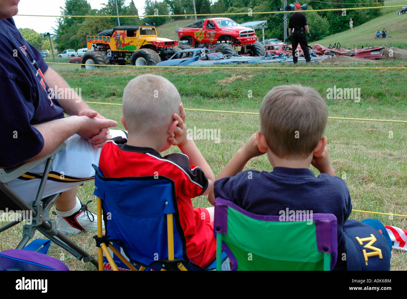 4 yearold boys cover ears at Monster Truck Race, Inwood Ontario Canada