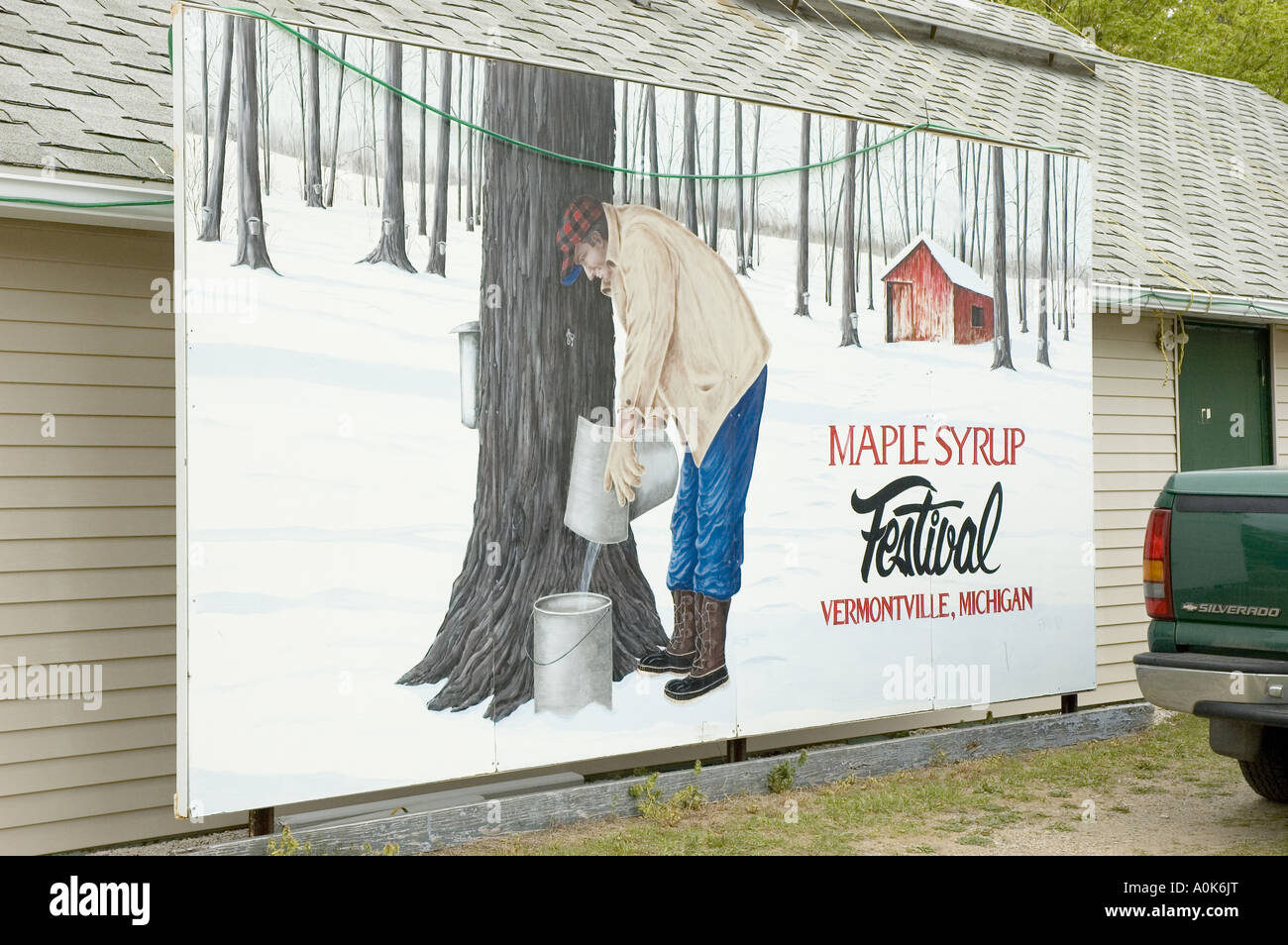 Painting depictiing Maple Syrup tapping on side of building