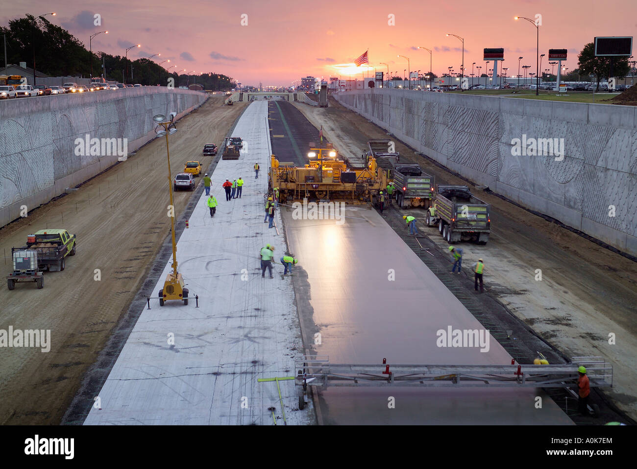 Paving crew spreads concrete for an urban multilane highway Wichita