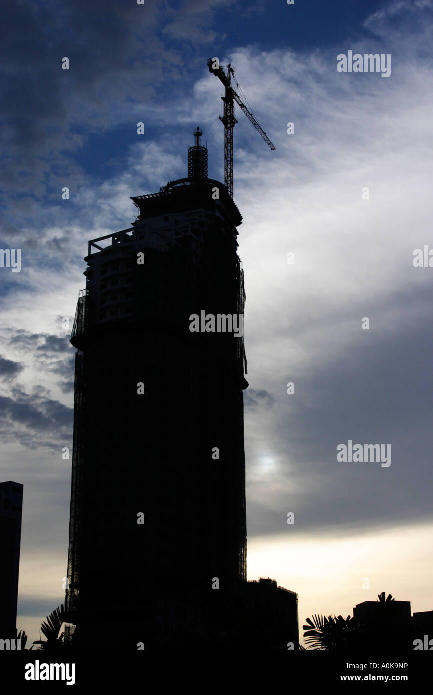 crane on top of building under construction in Kuala Lumpur, Malaysia