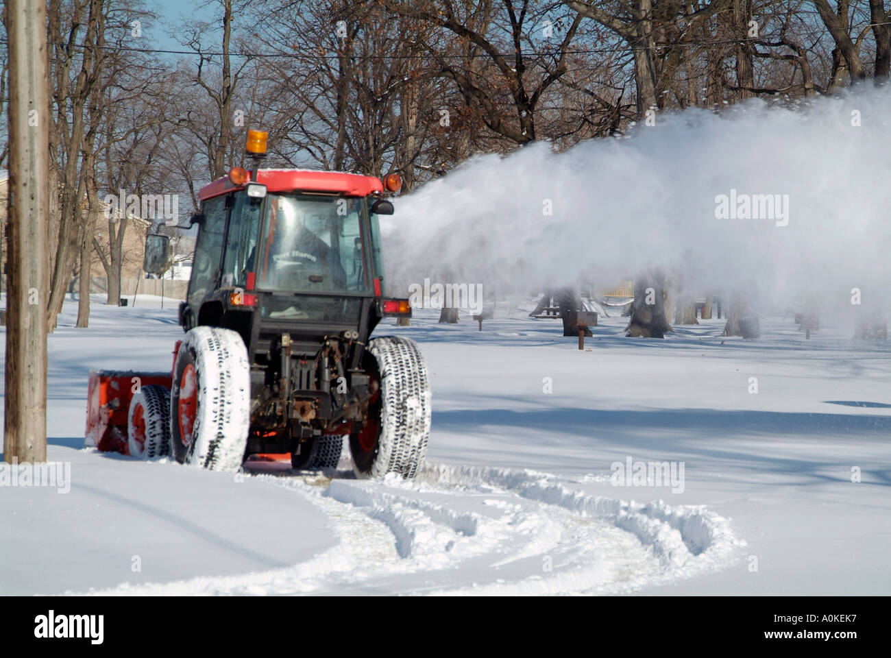 Clearing Snow From Property With heavy duty Snow Blower equipment Stock Photo Alamy