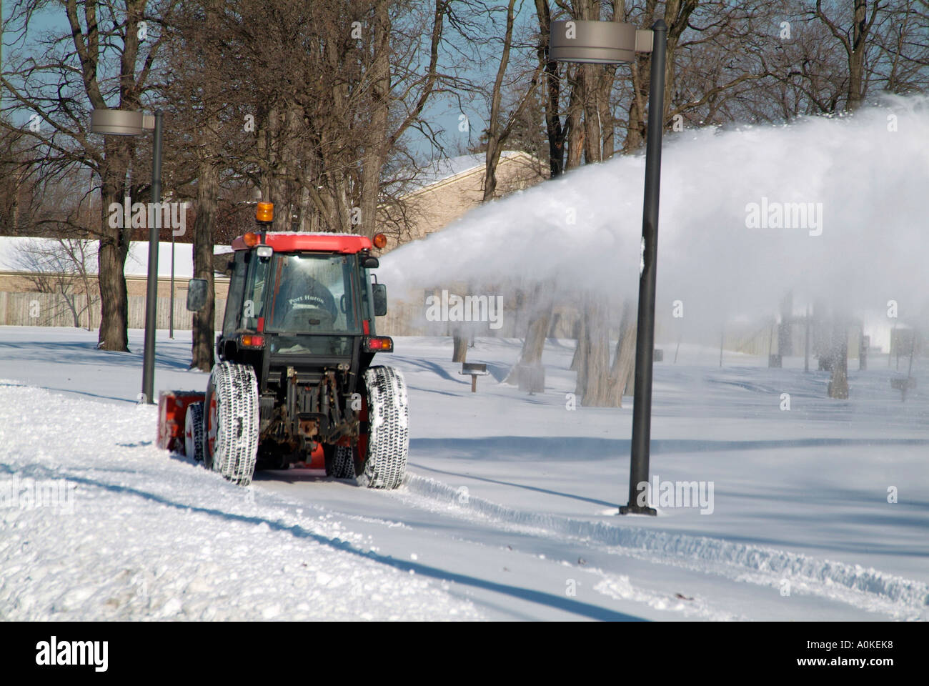 Clearing Snow From Property With heavy duty Snow Blower equipment Stock Photo Alamy
