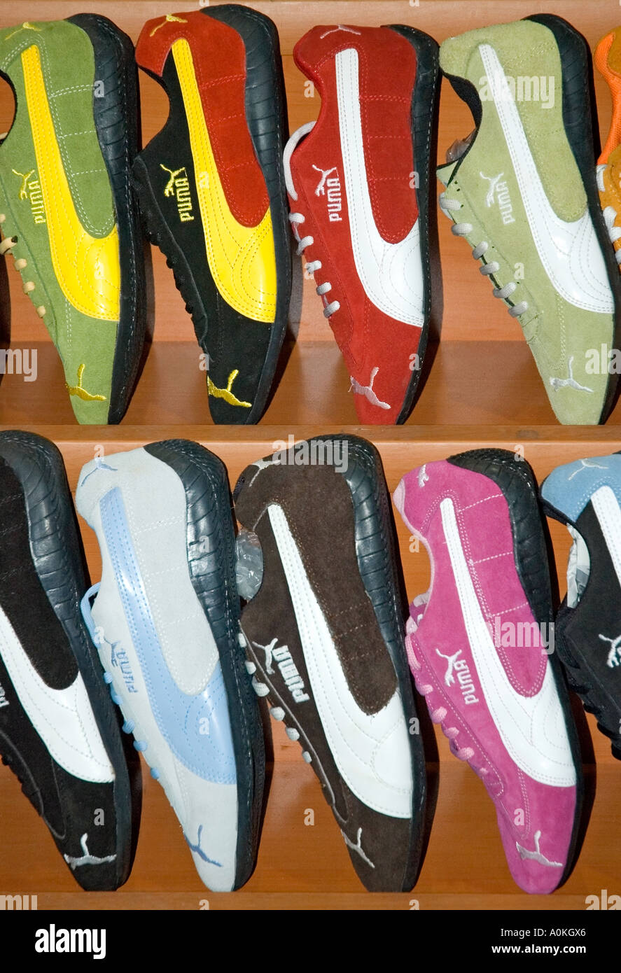 Sneakers are seen on a running shoe display inside the Puma SE