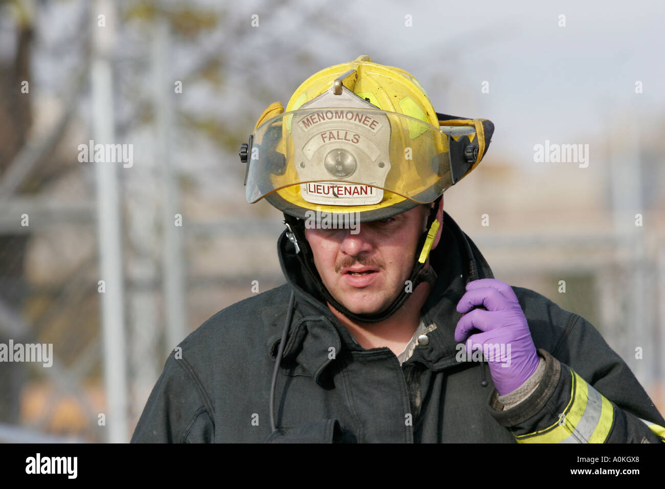 A fire fighter is talking on the radio at a mass casualty scene Stock Photo Alamy