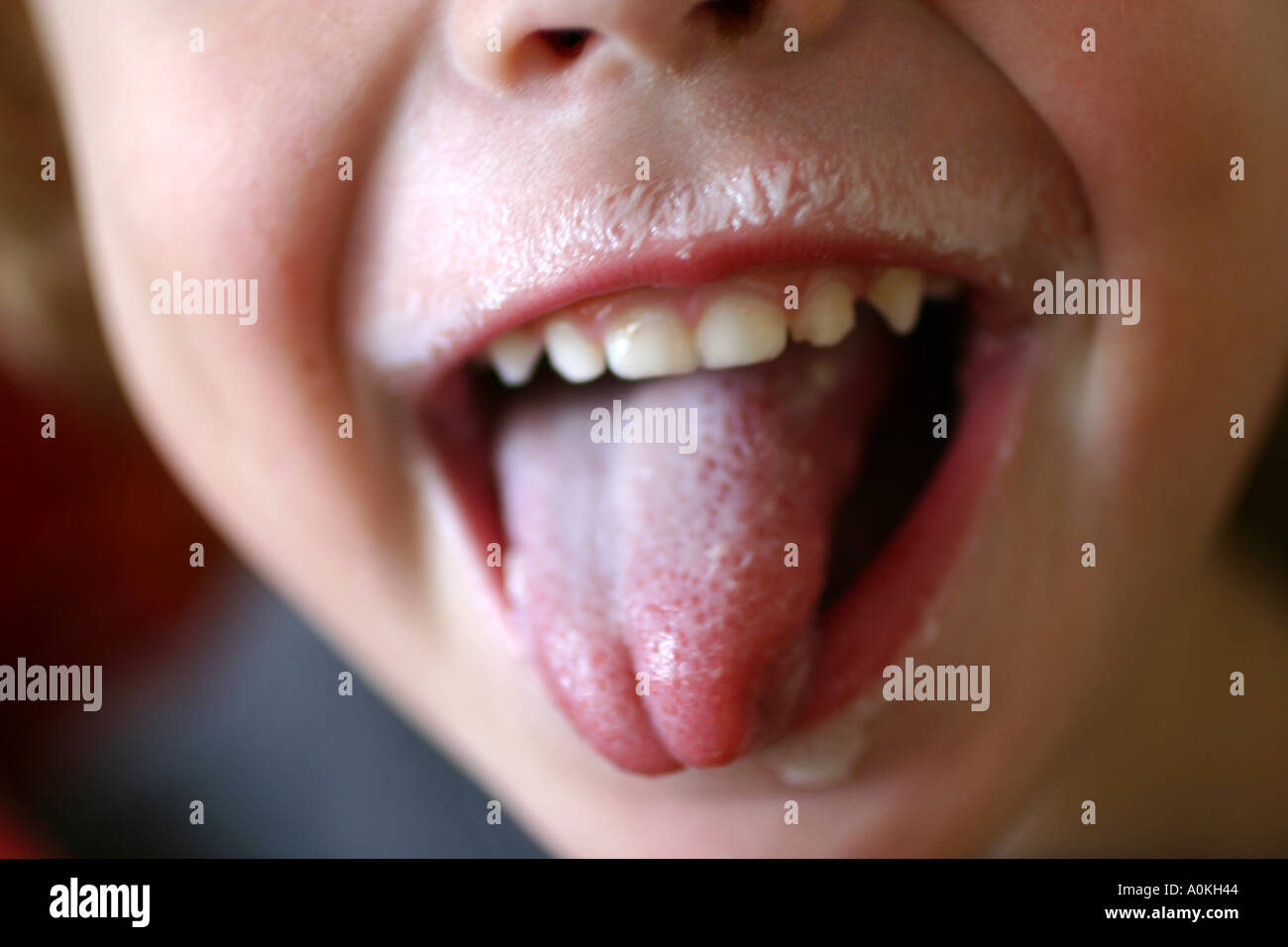 child sticking out tongue Stock Photo - Alamy