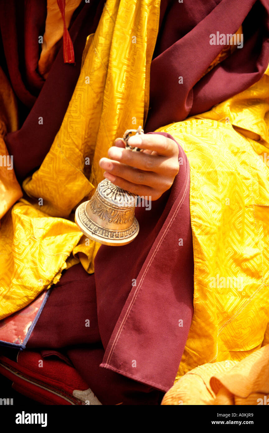 Buddhist monk of the ancient Bon religion rings temple bell during