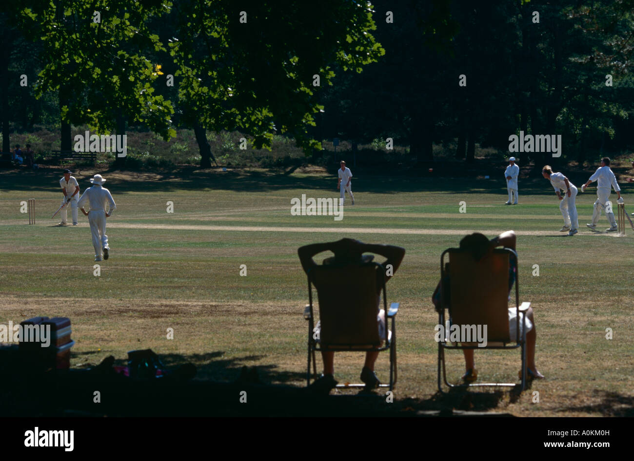 watching village cricket match at Blackheath Guildford Surrey Stock