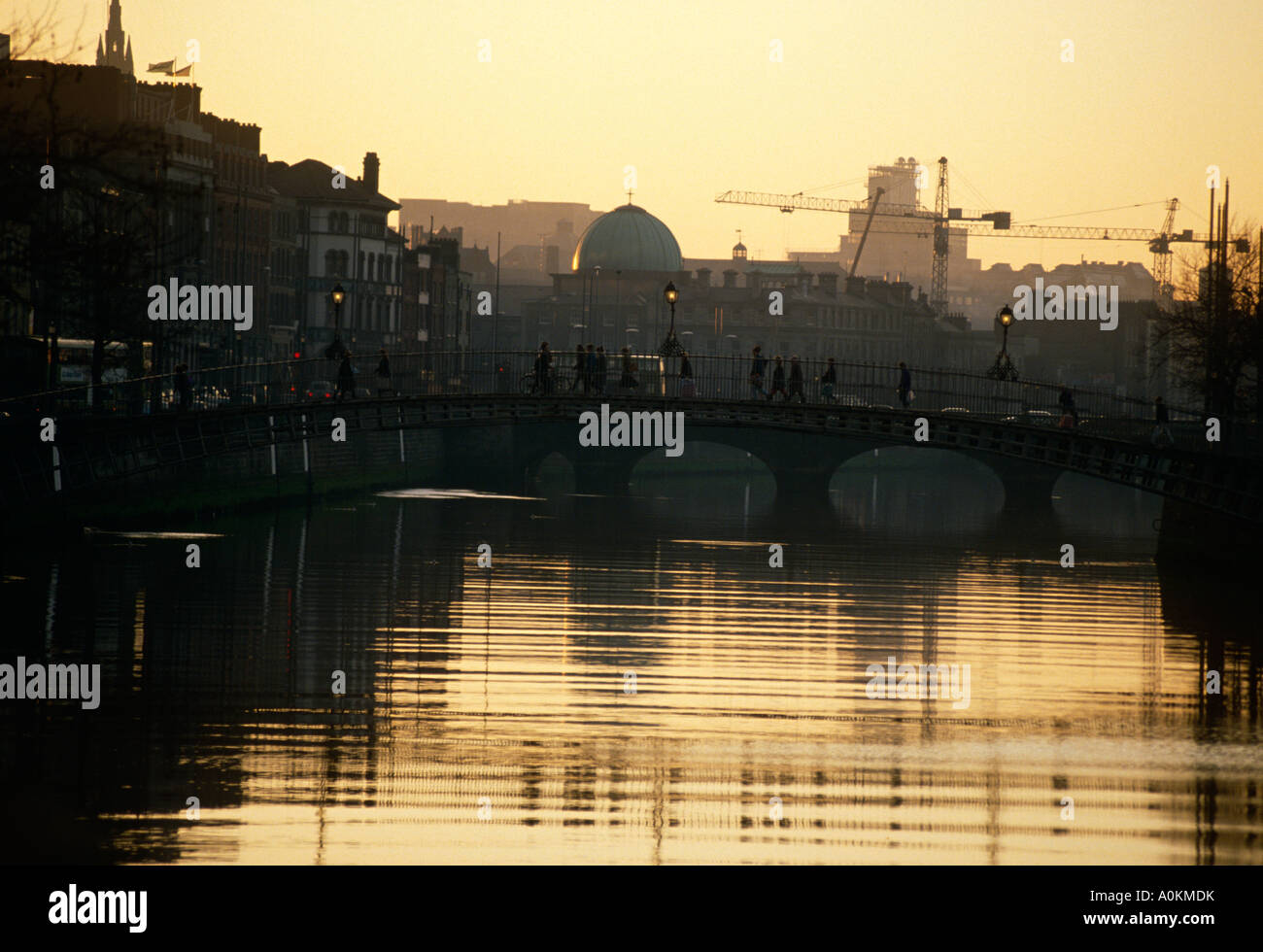 The Hapenny Bridge over the River Liffey in Dublin, Ireland Stock Photo ...