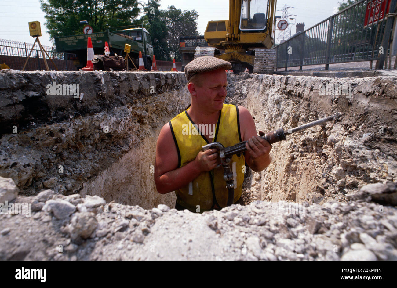 A man digging a hole in the road in London UK Stock Photo 10020224 Alamy