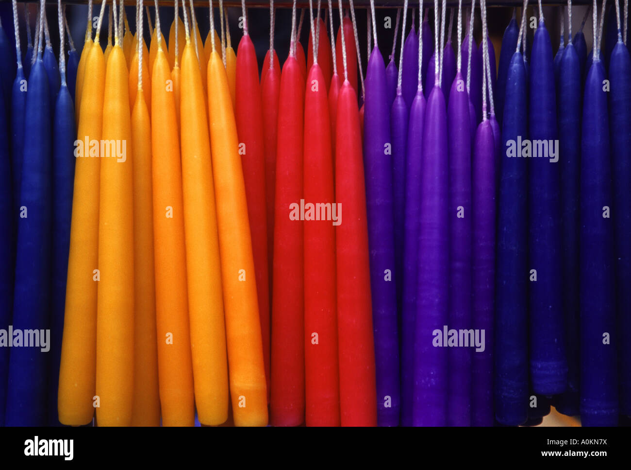 Colourful handmade candles for sale in the street market in Bath